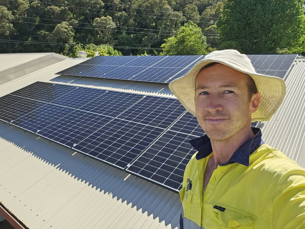 Xavier Waters, Director of Alpex Electrical and Solar on a recent solar installation on a roof.